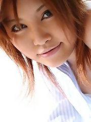 Horny Asian model shows off her tits