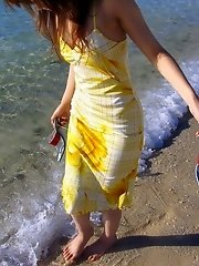 Cute Asian model likes posing on the beach