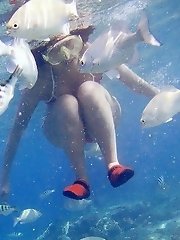 Naughty Asian teen naked on the beach has fun