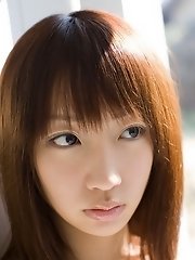 Cute innocent teen model shyly smiles