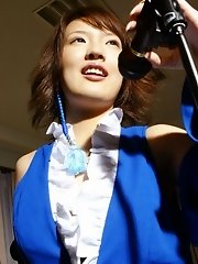 Slutty Asakura sings on stage and strips