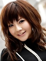 Asian slut poses in her street clothes