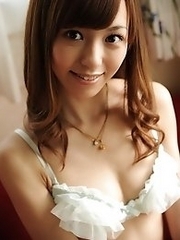 Beautiful and skinny Japanese av idol Aino Kishi shows her naked body on colorful sofas