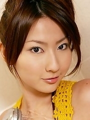 Busty and cute Japanese av idol Megumi Haruka wears a yellow one piece and takes shower