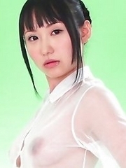 On the green screen Reina ran her hands across her see through outfit