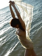 Beautiful and sexy Japanese av idol Mari Misaki goes to the beautiful beach and gets naked