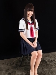 Schoolgirl seductress Aino Neko casually jerking a cock with her soft feet