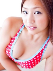 Ayaka Sayama Japan smiles while revealing curves in red lingerie