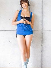 Mikie Hara with big tits and sexy legs listens to the music