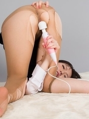 Yuma Miyazaki posing in black stockings and heels, looking seductive as fuck