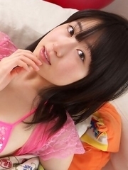 Hijiri Sachi has sexy tummy and juicy jugs in pink lingerie