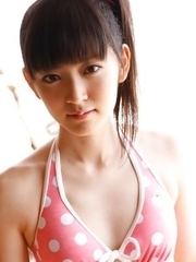 Airi Suzuki in cute bath suit enjoys hot sand on her curves