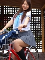 Misaki Nito in school uniform goes to classes riding bike