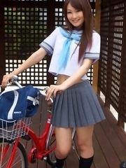 Misaki Nito in school uniform goes to classes riding bike