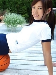 Ayaka Enomoto in sports outfit plays with ball outdoor