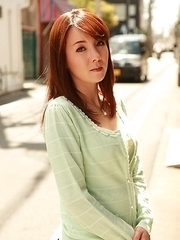 Chika Sasaki in green sweater and short skirt