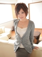 Kaede Oshiro with busy mouth shows sexy legs