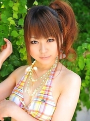 Asian girls pose in bikinis outside